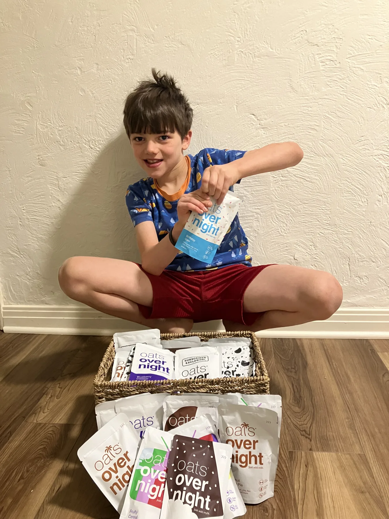Aiden holding an overnight oats packet with Tap Caps Connect food bags